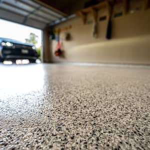 A car pulling into a garage with an epoxy floor